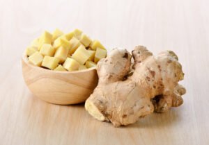 ginger sliced in wood bowl